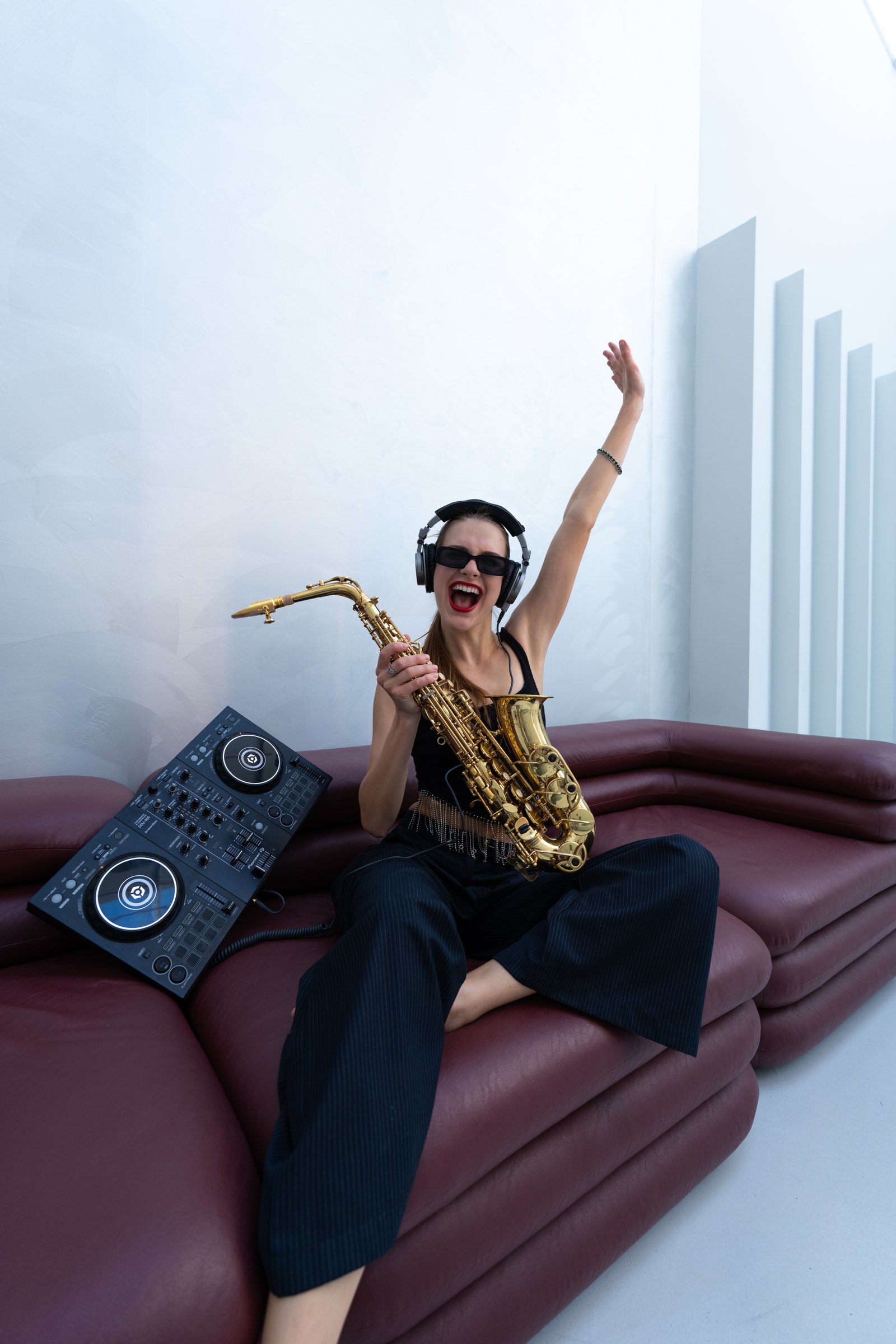 Violetta with saxophone and DJ decks
